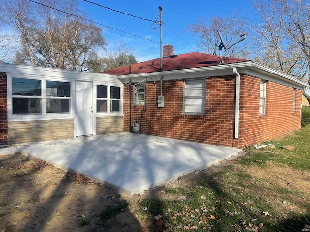 rear view of property featuring a patio