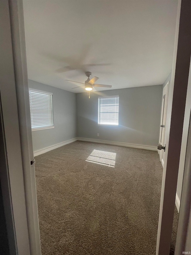 carpeted empty room with ceiling fan