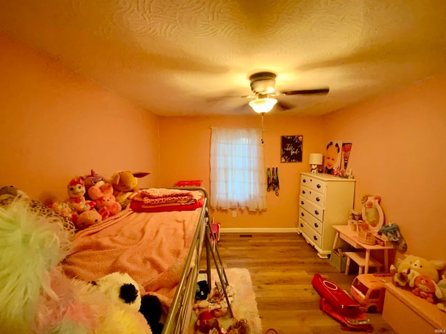 bedroom featuring light wood-type flooring and ceiling fan