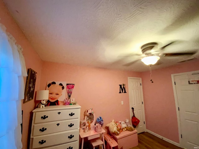 interior space featuring hardwood / wood-style floors and ceiling fan