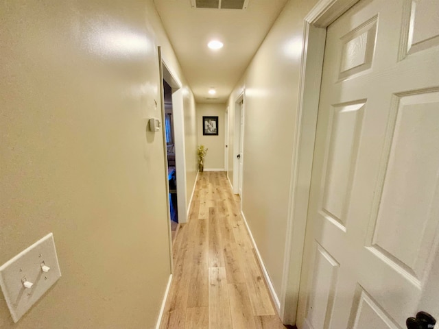 hallway with light wood-type flooring