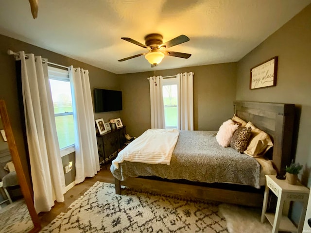 bedroom featuring ceiling fan and wood-type flooring