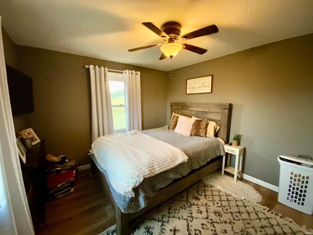 bedroom with hardwood / wood-style flooring and ceiling fan