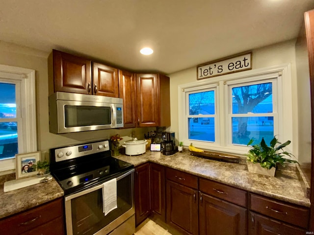 kitchen with stainless steel appliances and stone countertops