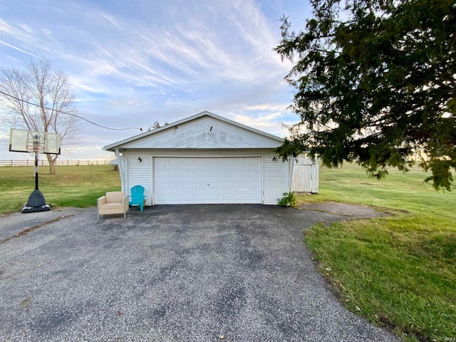 garage featuring a yard