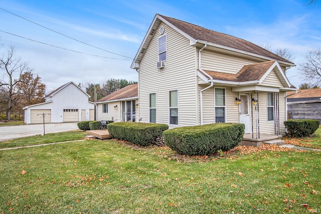 15560 County Road 44, Goshen, IN 46526 - view of front of house featuring an outdoor structure, a detached garage, and a front yard
