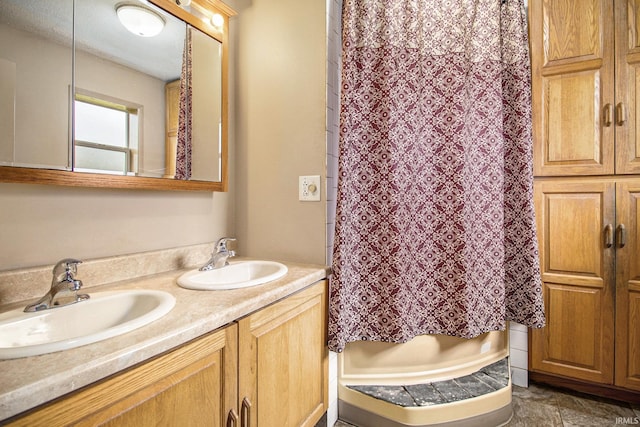 bathroom with vanity and curtained shower