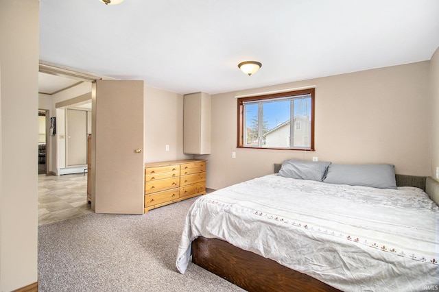 bedroom with light colored carpet