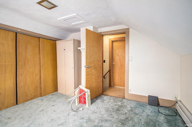 bonus room featuring baseboard heating, lofted ceiling, and light carpet