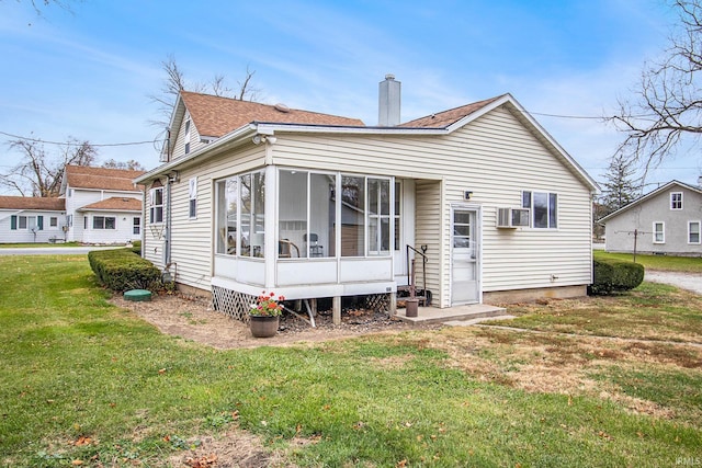 15560 County Road 44, Goshen, IN 46526 - back of property with a chimney, a lawn, a sunroom, roof with shingles, and cooling unit