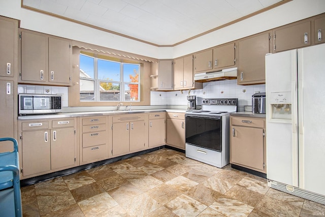 kitchen featuring backsplash, white appliances, sink, and crown molding