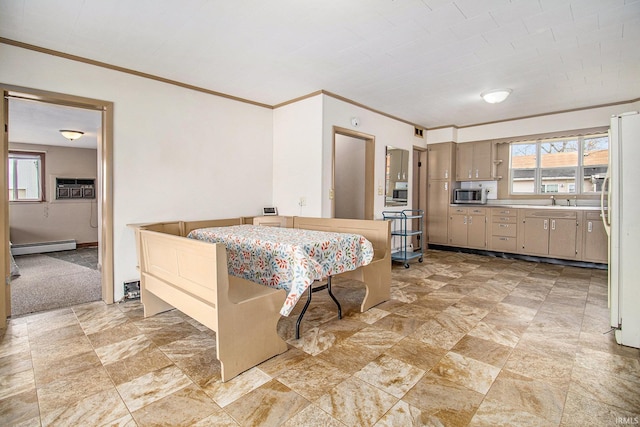 kitchen with a wall unit AC, a baseboard radiator, white fridge, and crown molding