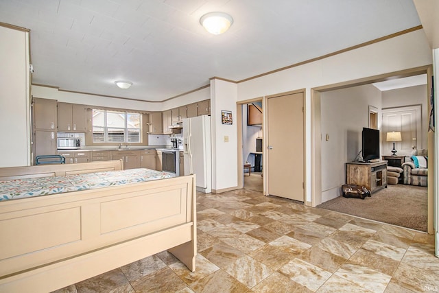 kitchen with stainless steel appliances, light colored carpet, and crown molding