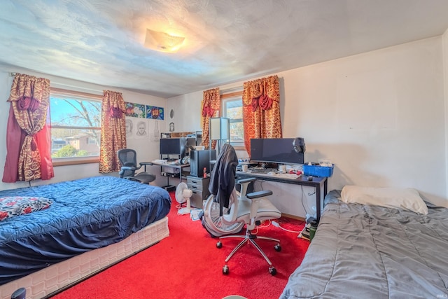 carpeted bedroom featuring multiple windows