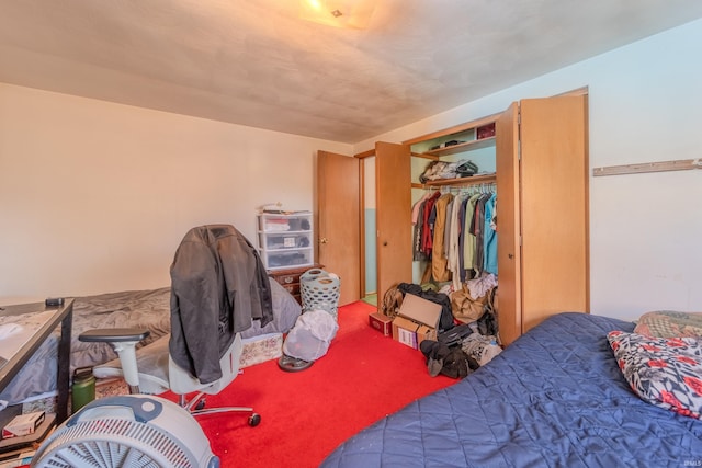 bedroom with carpet flooring and a closet