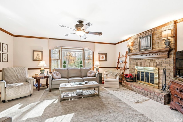 living room with ornamental molding, a fireplace, light carpet, and ceiling fan