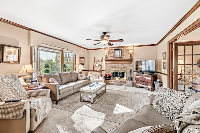 carpeted living room with ornamental molding, ceiling fan, and a brick fireplace