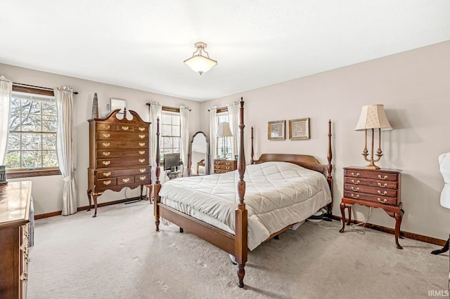 bedroom featuring light carpet