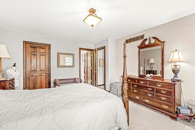 bedroom with light colored carpet