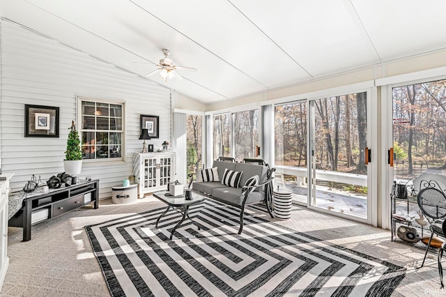 sunroom with ceiling fan, a healthy amount of sunlight, and vaulted ceiling