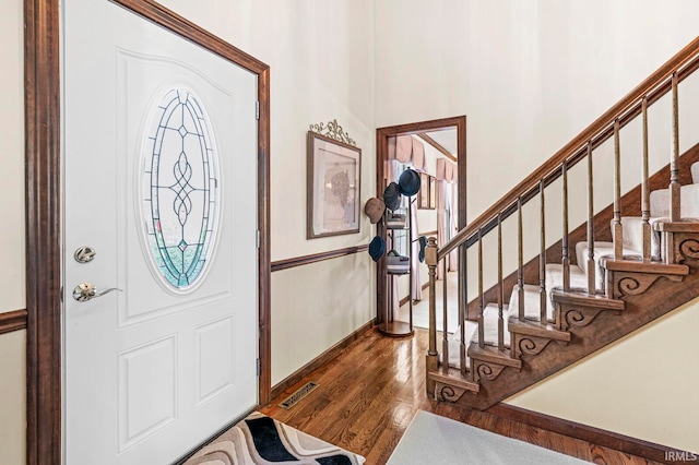 entryway with hardwood / wood-style floors