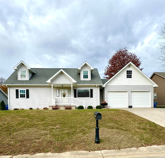 cape cod-style house featuring a garage, covered porch, and a front yard