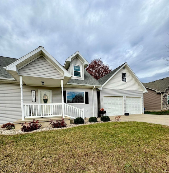 view of front facade with a front lawn, a garage, and covered porch