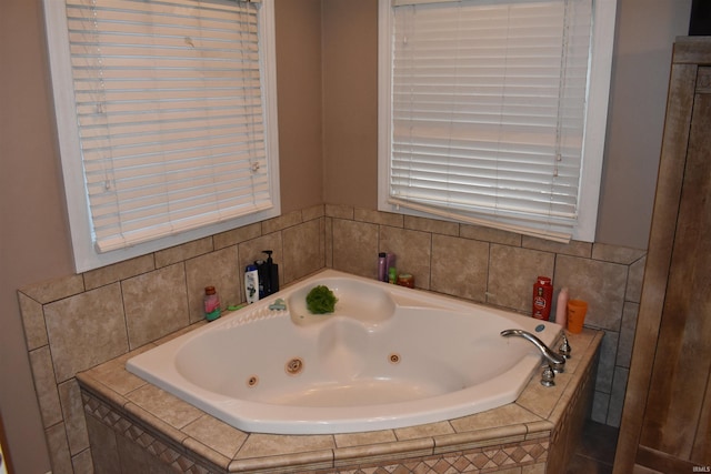 bathroom with a relaxing tiled tub