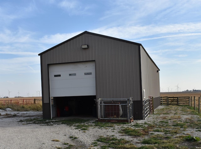 garage featuring a rural view