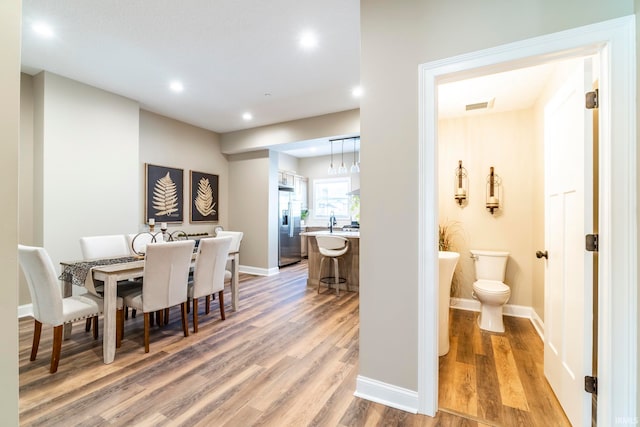 dining area featuring hardwood / wood-style flooring