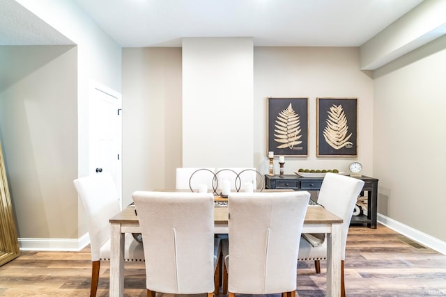 dining area featuring light wood-type flooring