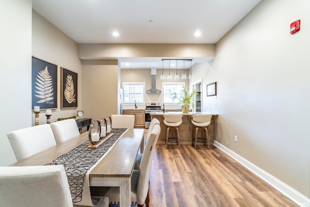 dining space featuring light hardwood / wood-style floors