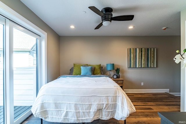 bedroom with ceiling fan and dark hardwood / wood-style flooring