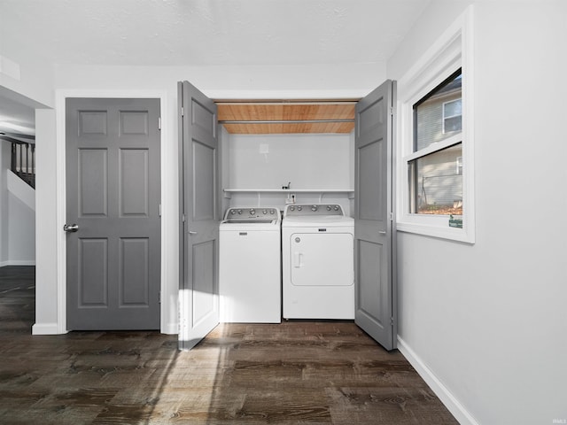 washroom with dark hardwood / wood-style flooring and washer and dryer