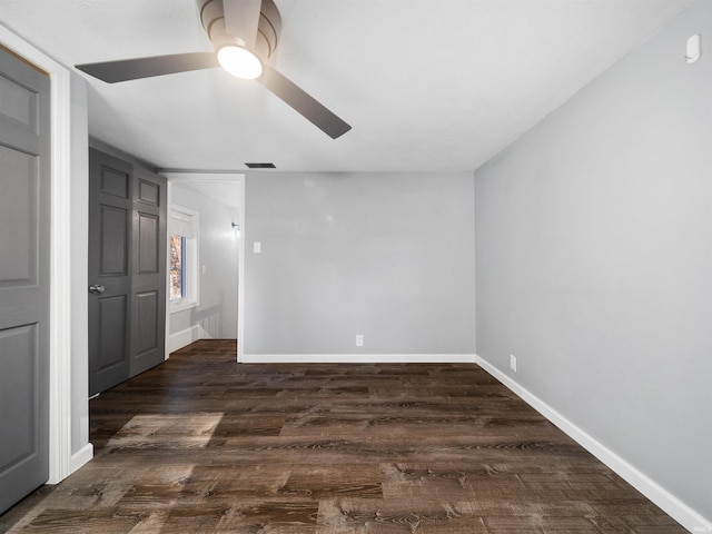 unfurnished bedroom with dark wood-type flooring and ceiling fan