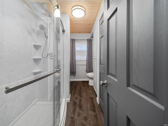 bathroom featuring wooden ceiling, wood-type flooring, a shower with door, and toilet