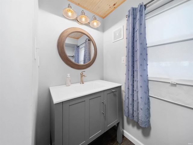 bathroom featuring vanity and wood ceiling