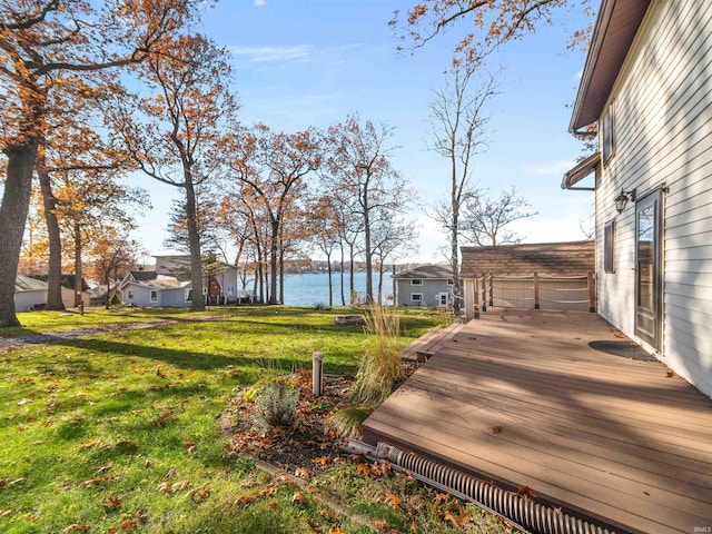 view of yard featuring a deck with water view