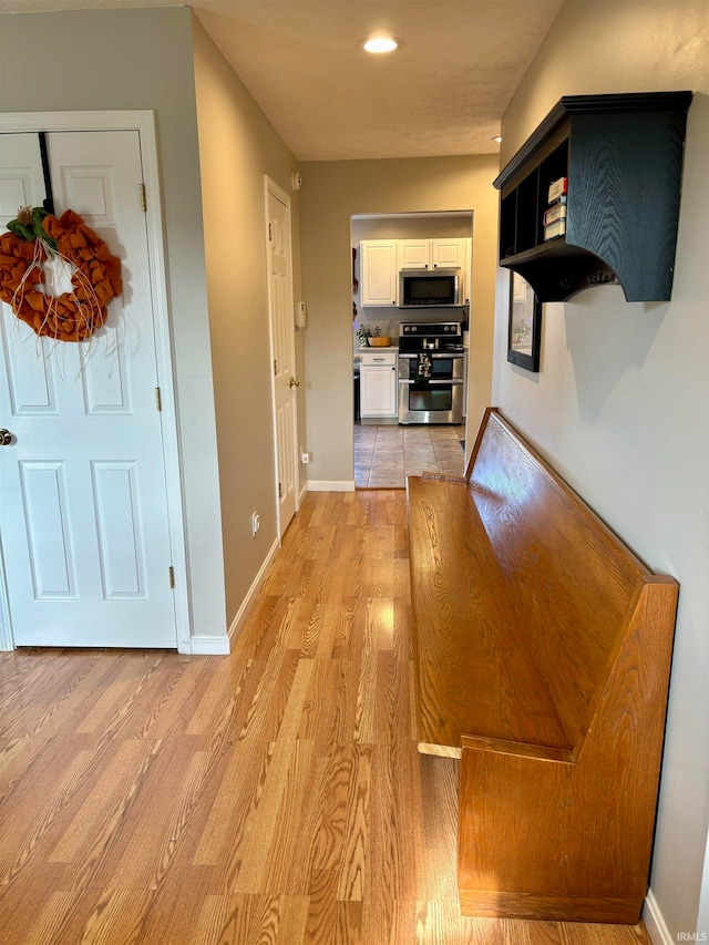 corridor featuring light wood-type flooring