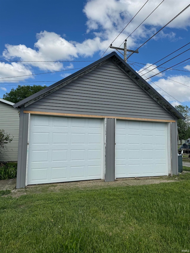 garage featuring a yard