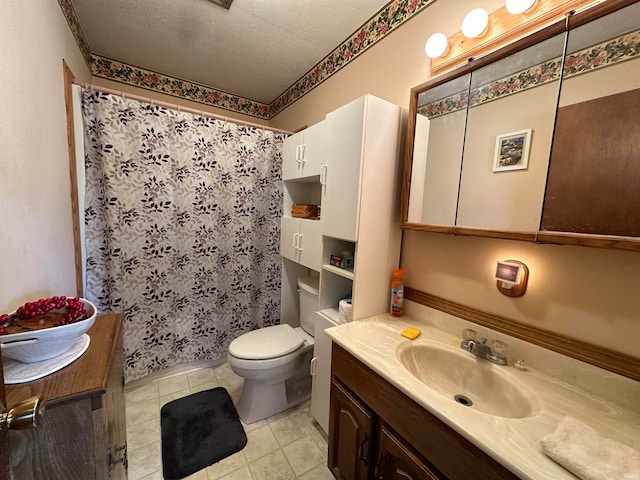 bathroom featuring tile patterned floors, toilet, a textured ceiling, vanity, and a shower with shower curtain