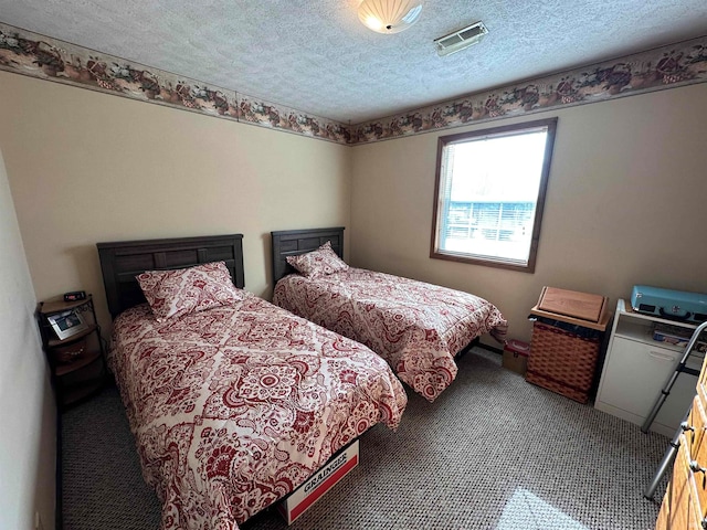 bedroom featuring a textured ceiling