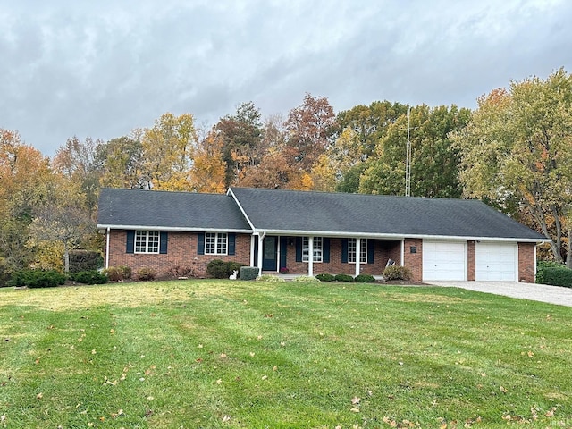 ranch-style home featuring a garage and a front yard