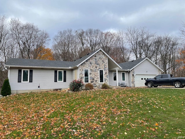 ranch-style home with a garage and a front yard