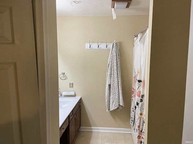 bathroom featuring vanity and a textured ceiling