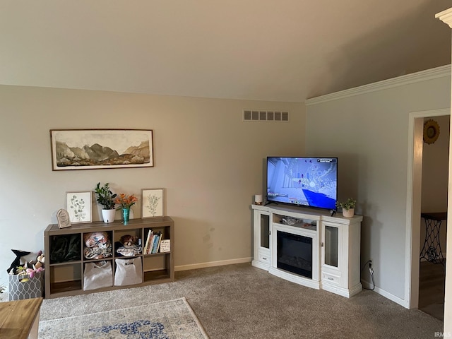 carpeted living room with crown molding