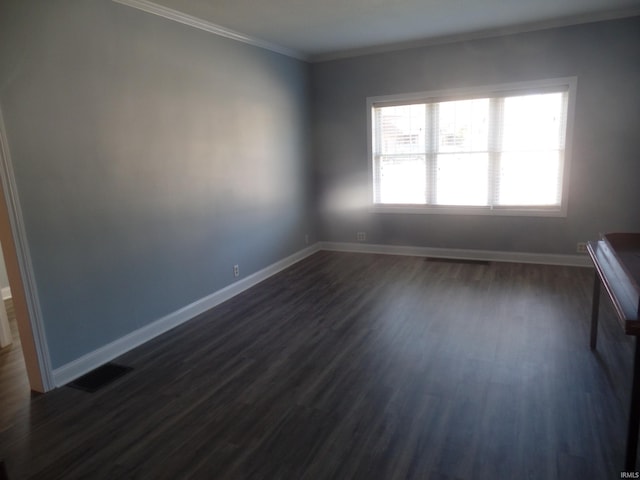 unfurnished room with dark hardwood / wood-style floors and crown molding