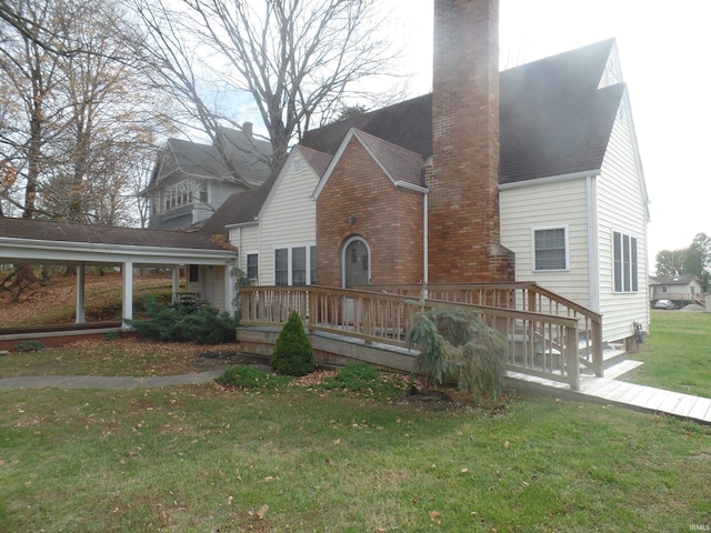 exterior space featuring a yard and a deck