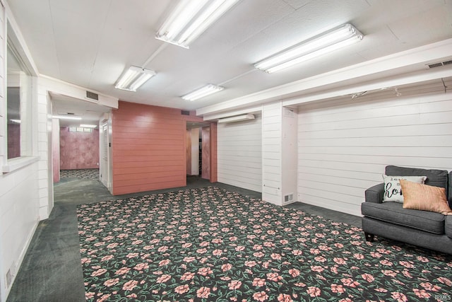 interior space featuring dark colored carpet