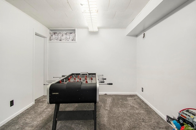 recreation room featuring dark carpet